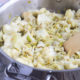 braised cauliflower leeks artichoke hearts in pan
