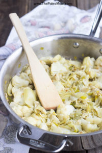 Braised Cauliflower Leeks and artichoke hearts in pan
