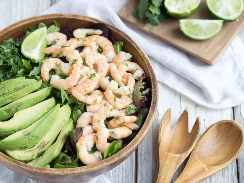 salad bowl with shrimp, lime and avocado