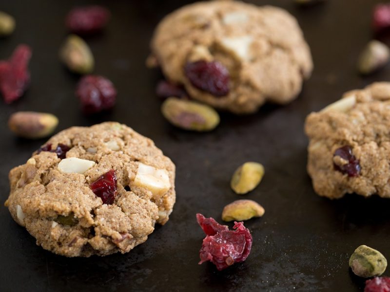 cookies on dark background with pistachios and cranberries