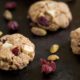 cookies on dark background with pistachios and cranberries