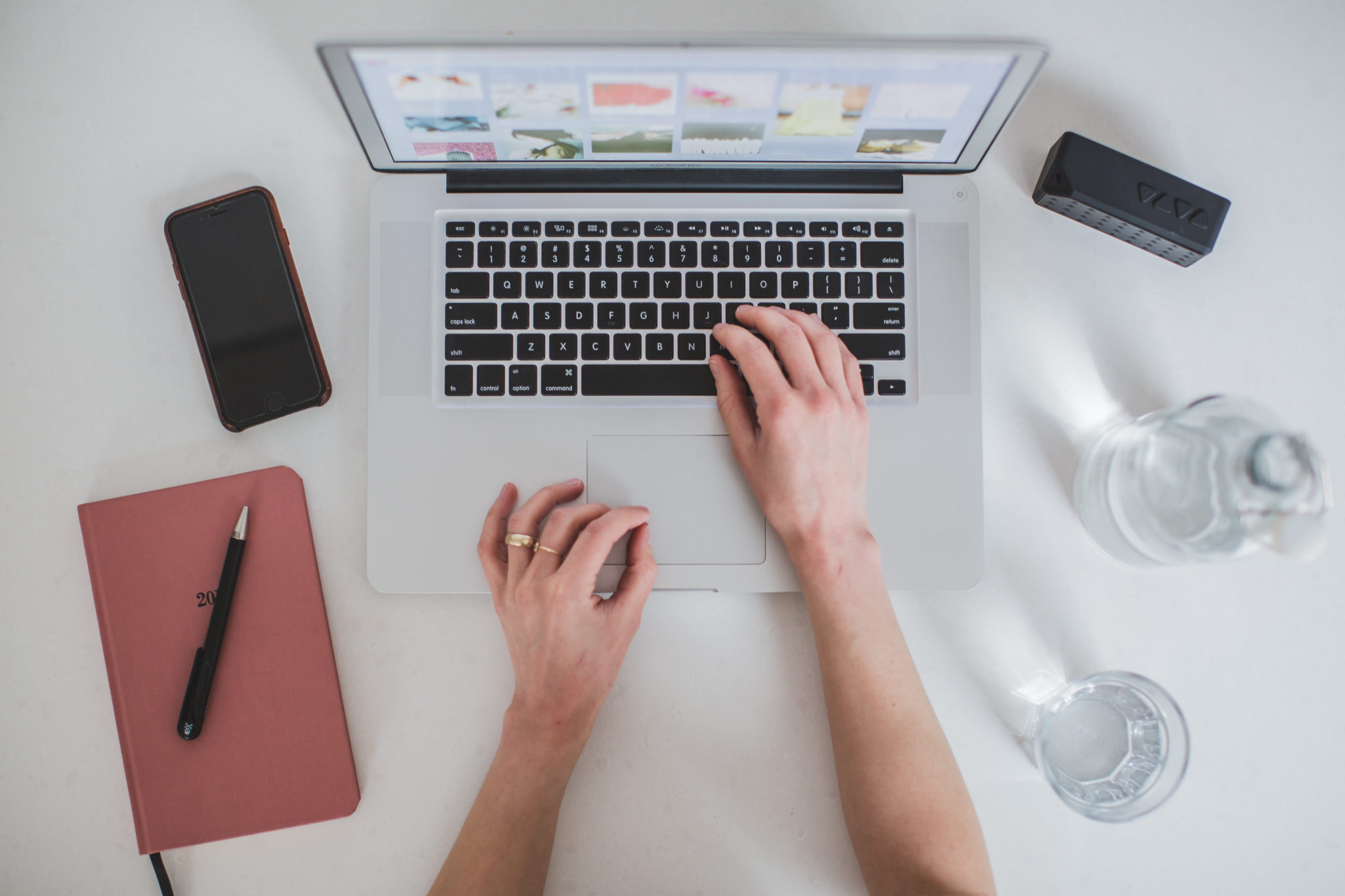 womans hands on a laptop